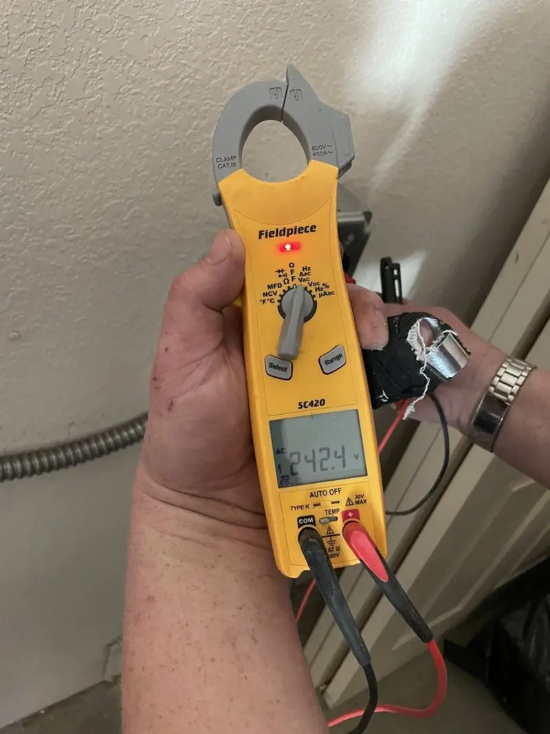 Voltage testing with clamp meter during Whole House Surge Protector in Myrtle Creek